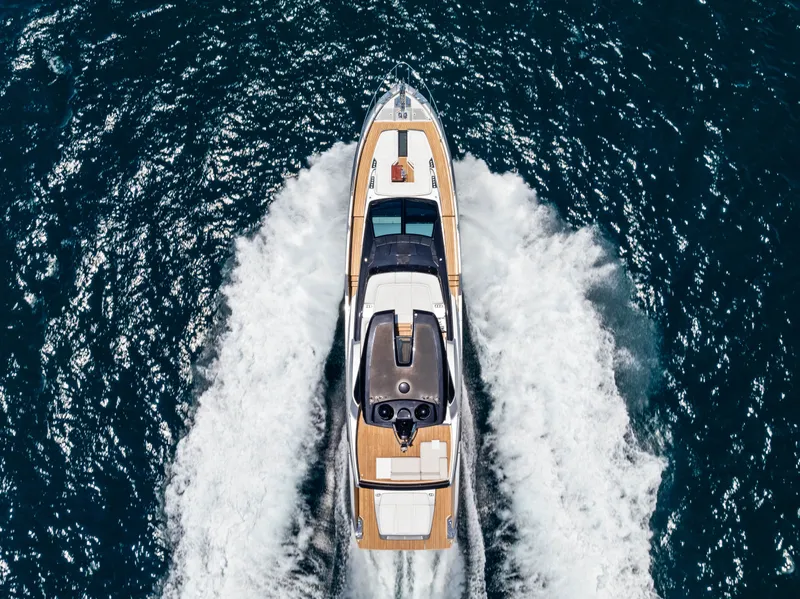 Slide: The Image of Aerial view of 2027 Riva 82' Diva yacht cruising on the sea. - 8
