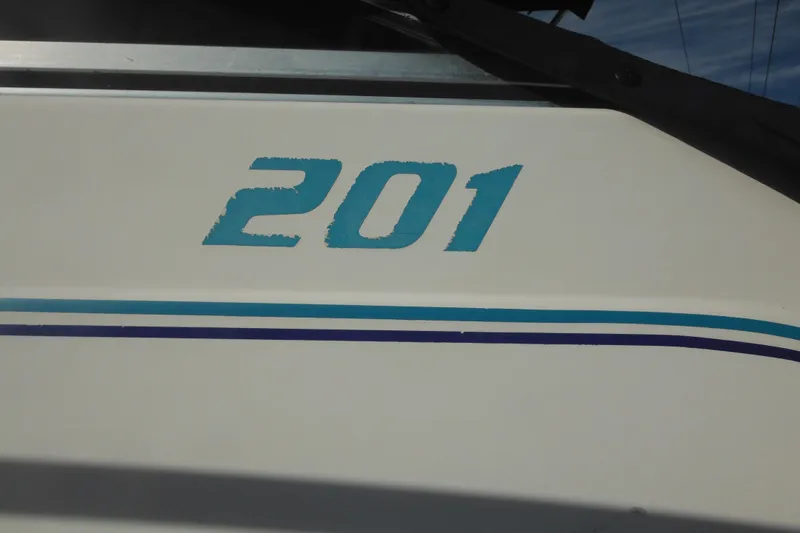 Slide: The Image of 1998 Pro-Line 201 Walkaround boat with blue number decal on side. - 3