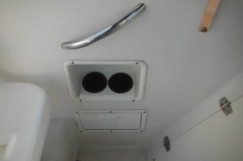 Slide: The Image of 1998 Pro-Line 201 Walkaround interior detail with cup holders and storage compartment. - 31