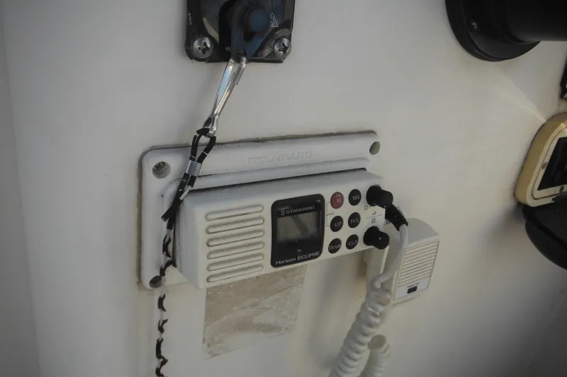 Slide: The Image of VHF radio installed on a 1998 Pro-Line 201 Walkaround boat dashboard. - 36