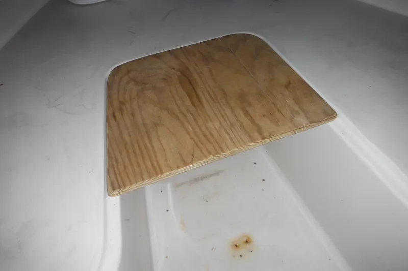 Slide: The Image of Wooden hatch cover on 1998 Pro-Line 201 Walkaround boat interior. - 42