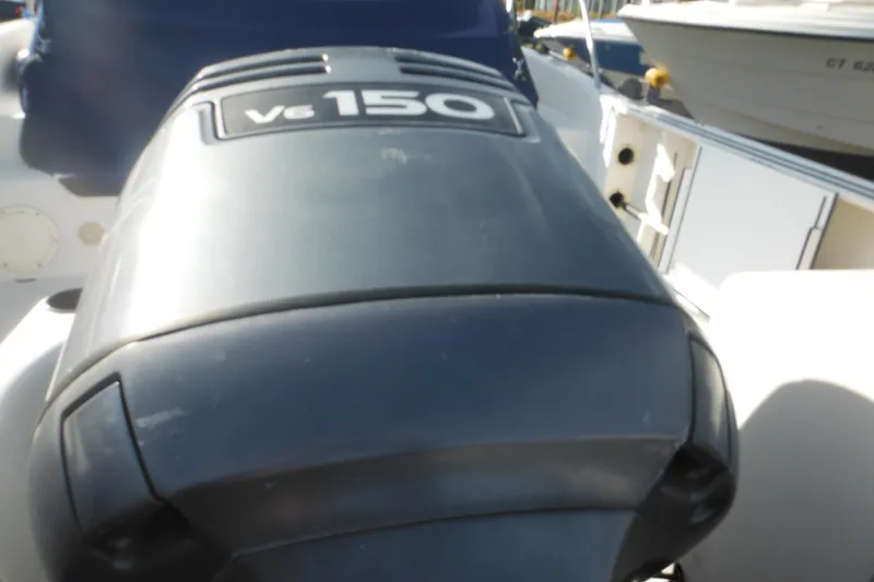 Slide: The Image of 1998 Pro-Line 201 Walkaround boat with V6 150 engine, close-up view. - 8