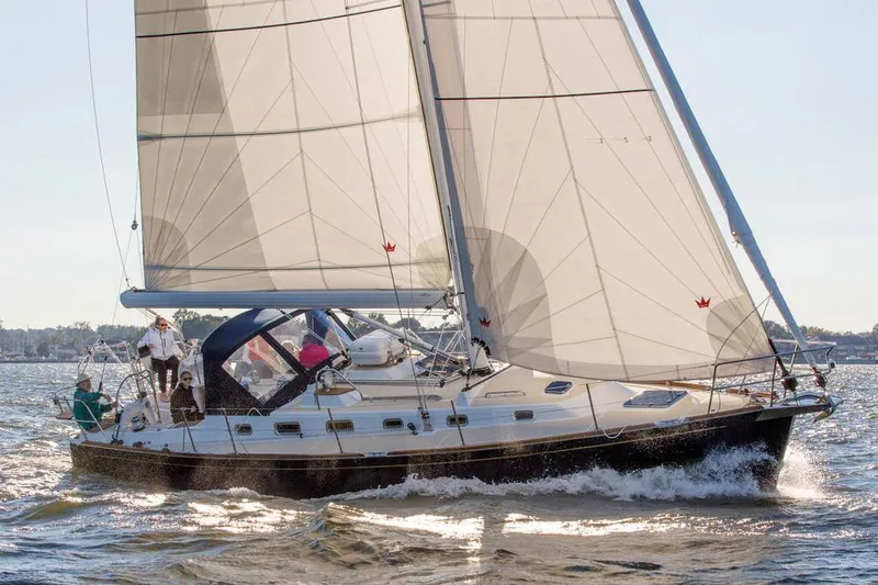 Slide: The Image of Manufacturer Provided Image: Sailing on a Tartan 395 yacht, 2026 model, with crew navigating open waters. - 2