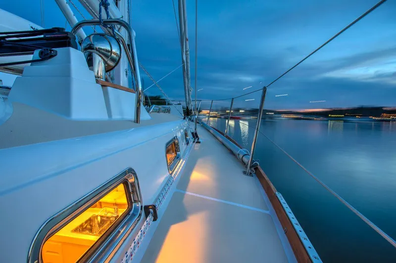 Slide: The Image of Manufacturer Provided Image: Sleek Tartan 395 yacht deck at sunset, 2026 model, reflecting serene waters. - 6