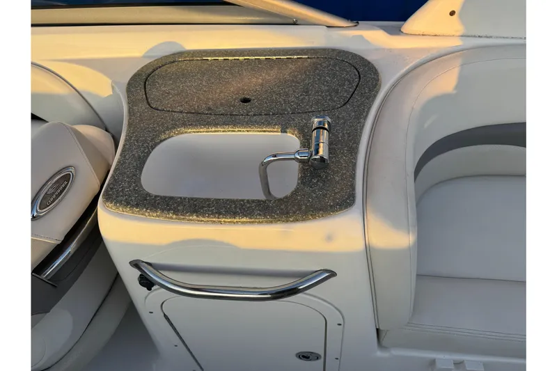 Slide: The Image of 2007 Chaparral 256 SSi boat interior with sink and faucet on countertop. - 21
