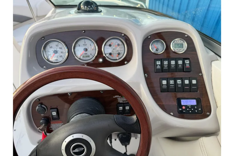 Slide: The Image of Dashboard of a 2007 Chaparral 256 SSi boat with gauges and controls. - 27