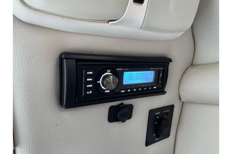 Slide: The Image of 2007 Chaparral 256 SSi boat interior with Clarion stereo system and control panel. - 33