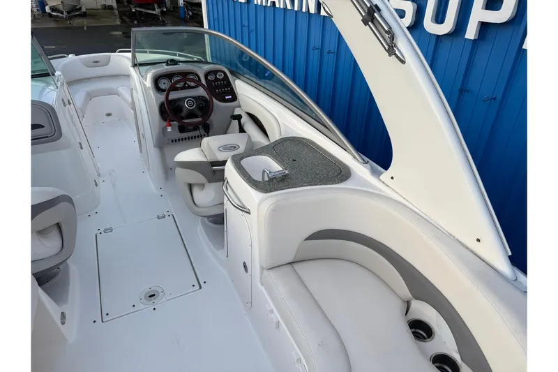 Slide: The Image of 2007 Chaparral 256 SSi boat interior with steering wheel and seating area. - 38