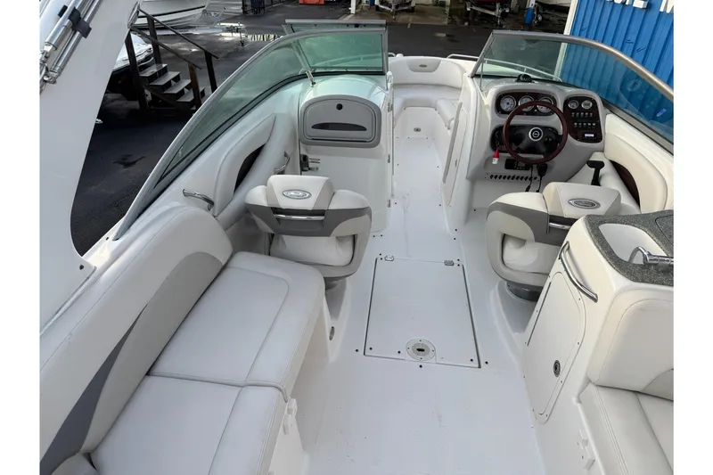 Slide: The Image of 2007 Chaparral 256 SSi boat interior with white seating and modern dashboard. - 39