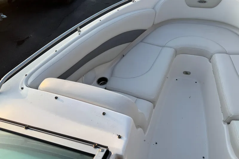 Slide: The Image of 2007 Chaparral 256 SSi boat interior with white cushioned seating. - 4