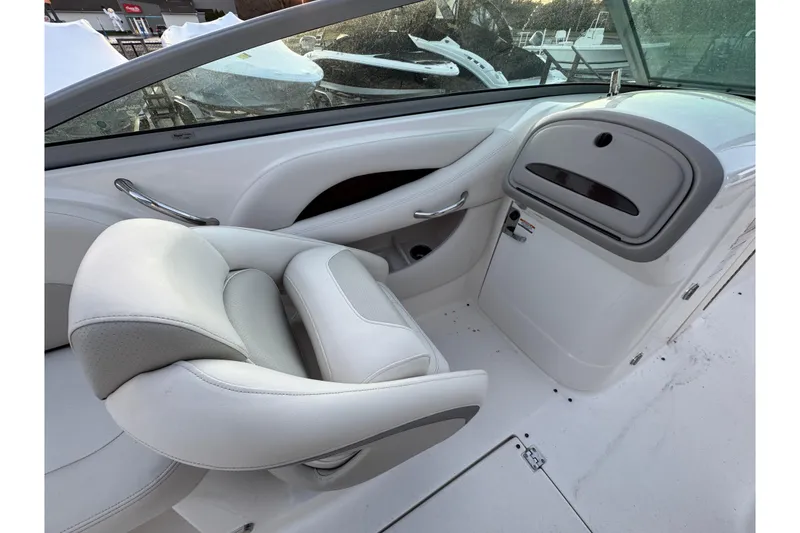 Slide: The Image of 2007 Chaparral 256 SSi boat interior with white seating and dashboard. - 40
