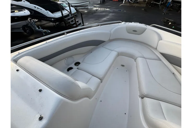 Slide: The Image of 2007 Chaparral 256 SSi boat interior with white seating and cup holders. - 43