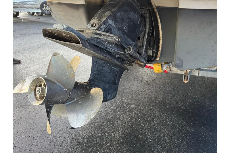 Slide: The Image of 2007 Chaparral 256 SSi boat propeller and outdrive on a wet surface. - 45