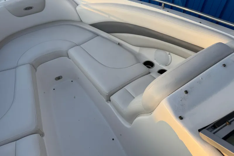 Slide: The Image of 2007 Chaparral 256 SSi boat interior with white seating and cup holders. - 5