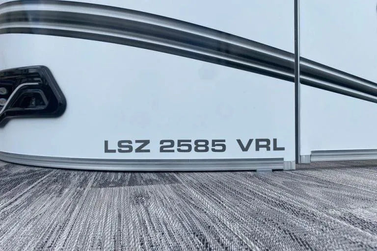 Slide: The Image of 2024 Avalon LSZ 2585 VRL boat exterior with model name displayed. - 2