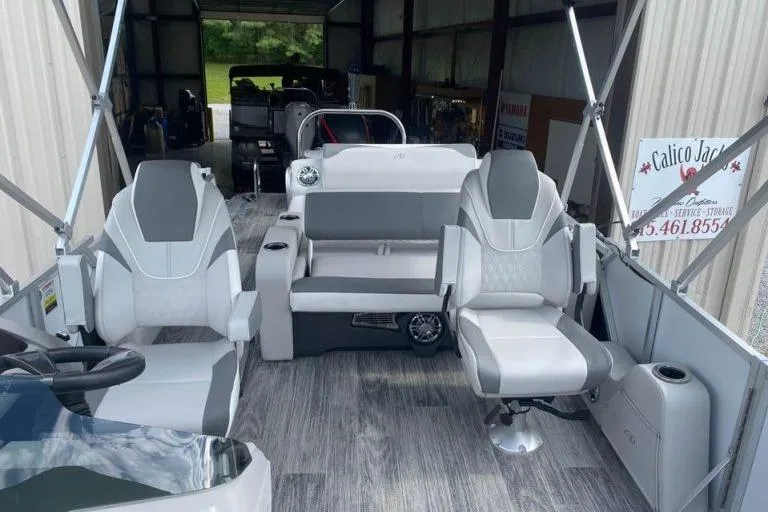 Slide: The Image of 2024 Avalon LSZ 2585 VRL pontoon boat interior with modern seating and sleek design. - 5