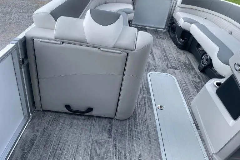 Slide: The Image of 2024 Avalon LSZ 2585 VRL pontoon boat interior with gray seating and flooring. - 9