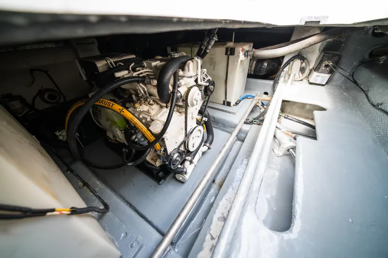 Slide: The Image of Engine room of 2003 Mainship 390 Trawler, showcasing mechanical components and wiring. - 21