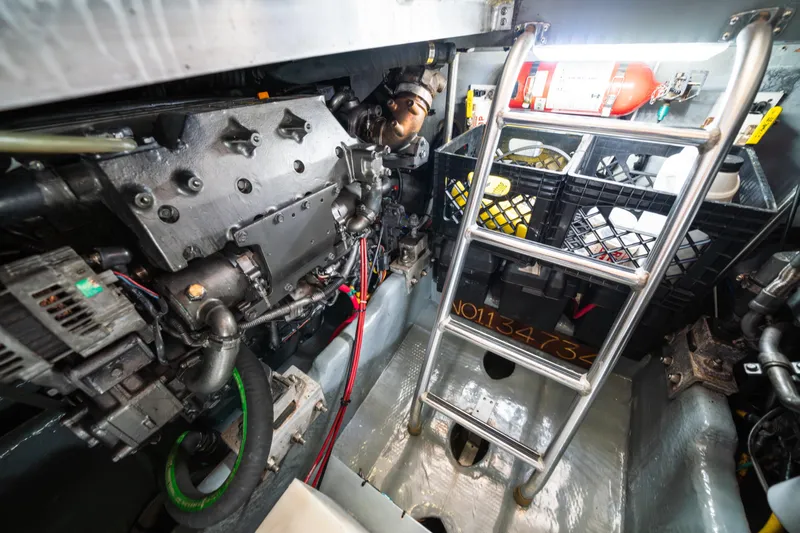 Slide: The Image of Engine room of 2003 Mainship 390 Trawler with ladder and equipment. - 24