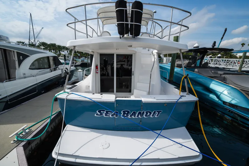 Slide: The Image of 2003 Mainship 390 Trawler "Sea Bandit" docked at marina, rear view. - 29