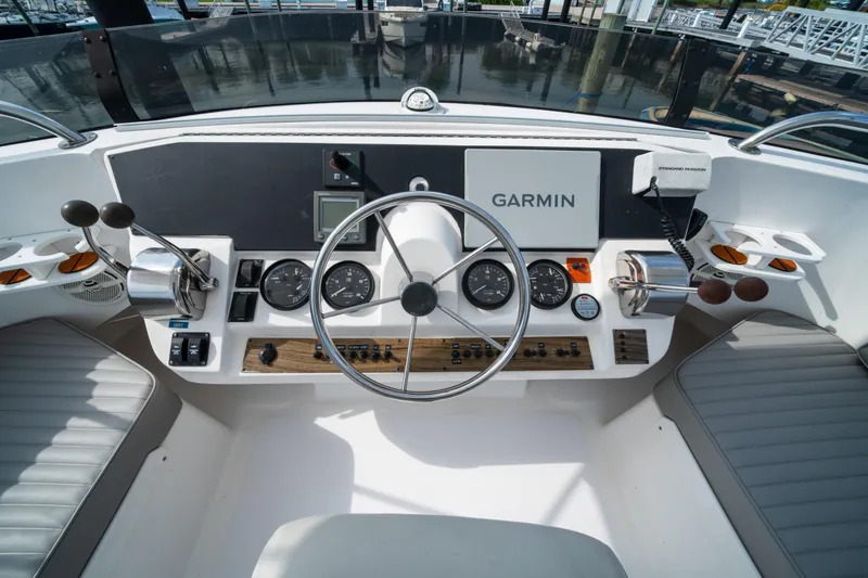 Slide: The Image of 2003 Mainship 390 Trawler helm with Garmin navigation and control instruments. - 7