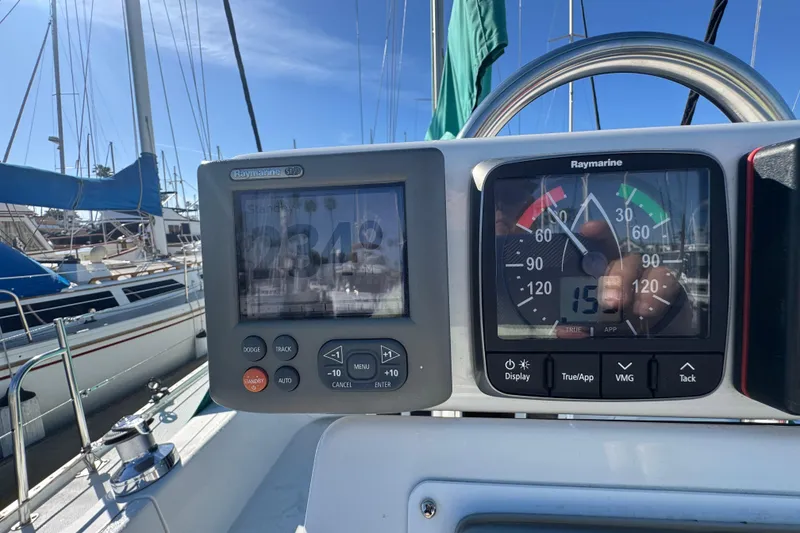 Slide: The Image of Cockpit instruments of a 1997 Catalina 36 MkII sailboat, showing navigation and wind data. - 10