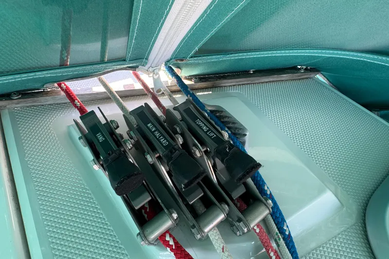 Slide: The Image of Sailing rigging on a 1997 Catalina 36 MkII, featuring vang, main halyard, and topping lift controls. - 21