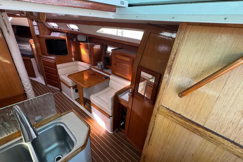 Slide: The Image of Interior of 1997 Catalina 36 MkII sailboat with wood finish and cozy seating area. - 26