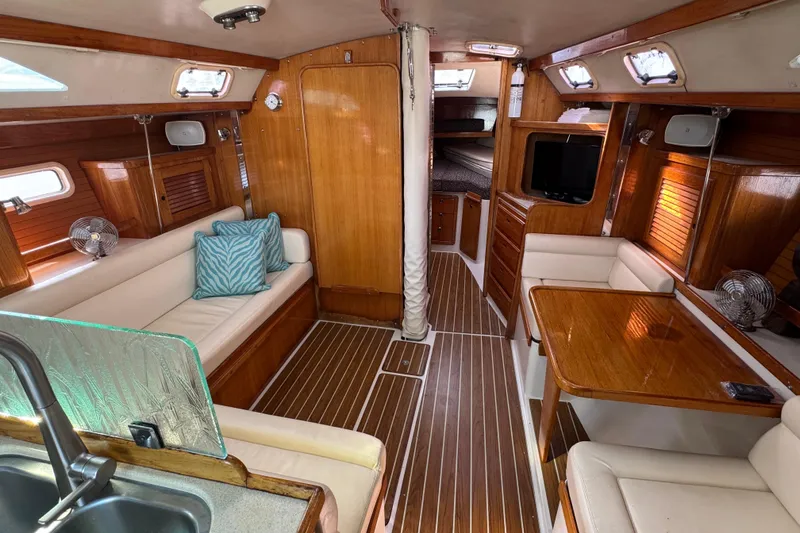 Slide: The Image of Interior of a 1997 Catalina 36 MkII sailboat with wood finish and cozy seating. - 27
