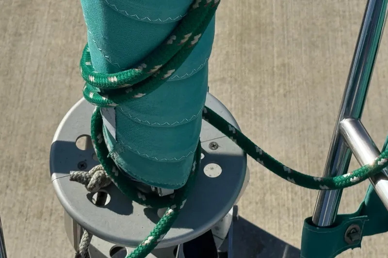 Slide: The Image of Close-up of Catalina 36 MkII sailboat rigging, featuring green ropes and sail, 1997 model. - 3