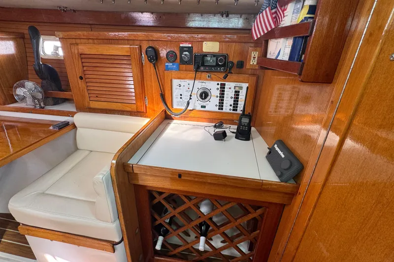 Slide: The Image of Interior of 1997 Catalina 36 MkII sailboat with navigation equipment and wooden cabinetry. - 33