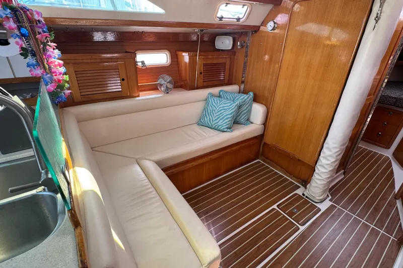 Slide: The Image of Interior of 1997 Catalina 36 MkII sailboat with wooden finish and cozy seating area. - 38