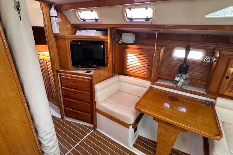 Slide: The Image of Interior of a 1997 Catalina 36 MkII sailboat with wood finish and seating area. - 39