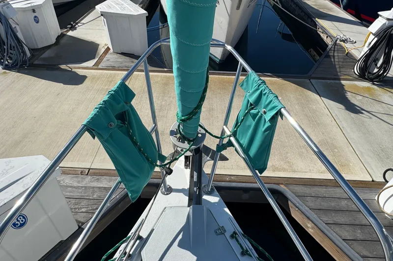 Slide: The Image of Bow of a 1997 Catalina 36 MkII sailboat docked at a marina. - 4