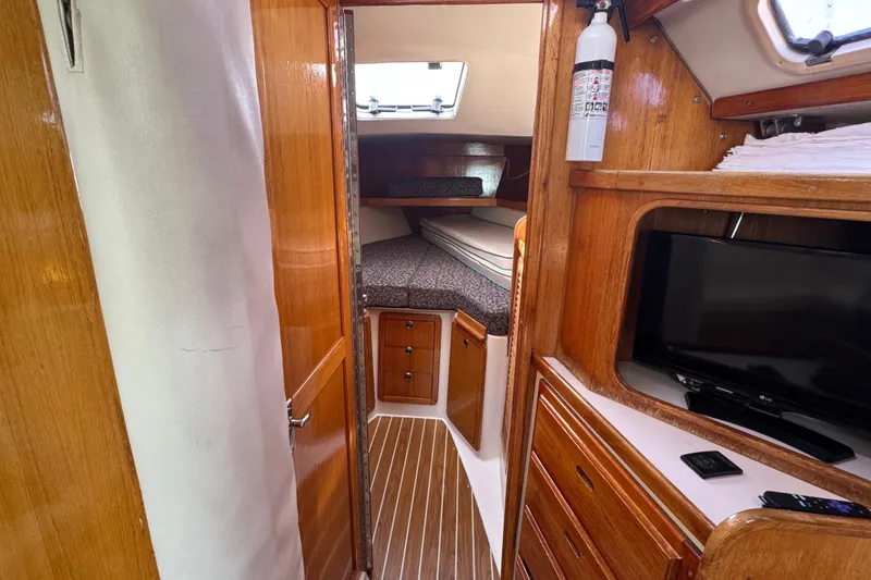 Slide: The Image of 1997 Catalina 36 MkII yacht interior with wood finish, cozy cabin, and modern amenities. - 40
