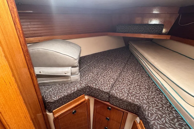 Slide: The Image of Cozy cabin interior of 1997 Catalina 36 MkII sailboat with patterned bedding. - 42