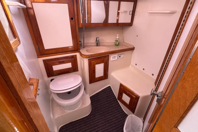 Slide: The Image of 1997 Catalina 36 MkII yacht bathroom with wooden cabinets and modern fixtures. - 43