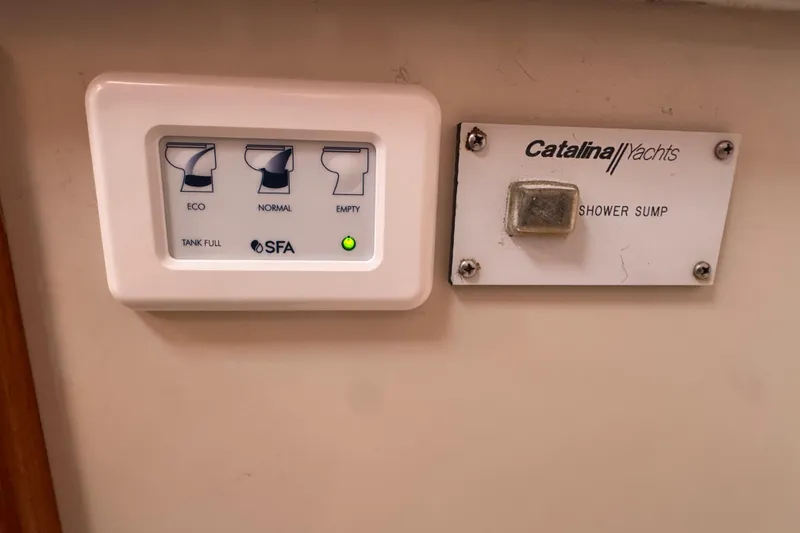 Slide: The Image of Control panel on a 1997 Catalina 36 MkII yacht, featuring eco, normal, and empty settings. - 44