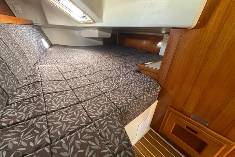 Slide: The Image of Cozy cabin interior of 1997 Catalina 36 MkII sailboat with patterned bedding. - 47