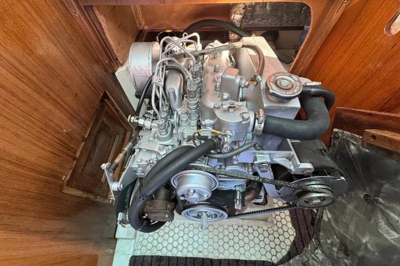 Slide: The Image of Engine of a 1997 Catalina 36 MkII sailboat, showcasing mechanical components. - 51