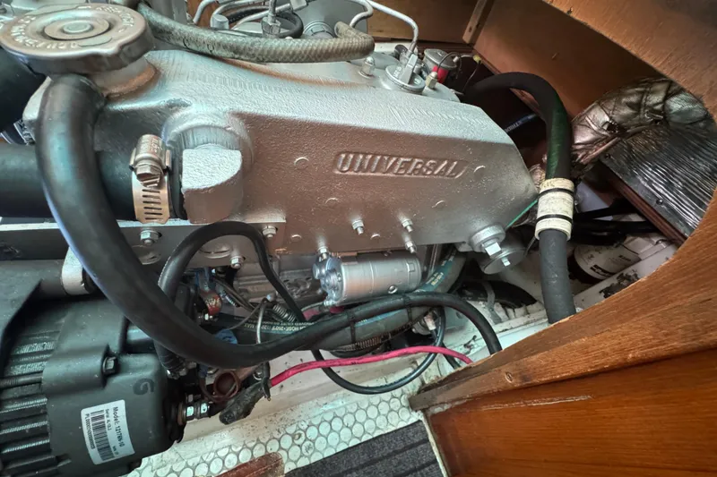 Slide: The Image of Engine compartment of a 1997 Catalina 36 MkII sailboat, featuring a Universal engine. - 52