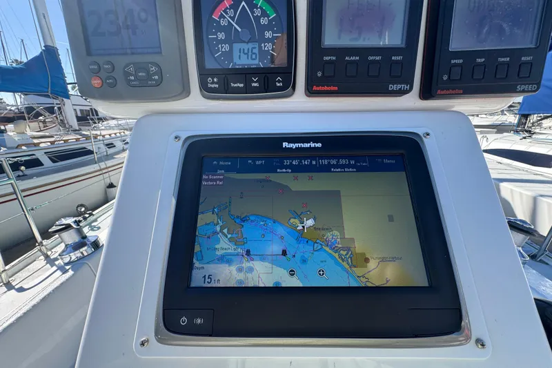 Slide: The Image of Navigation instruments on a 1997 Catalina 36 MkII sailboat, featuring Raymarine display. - 9