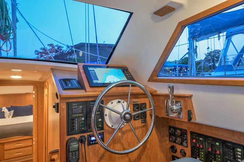 Slide: The Image of Manufacturer Provided Image: Interior of 2026 Tartan 455 yacht cockpit with navigation equipment and steering wheel. - 10