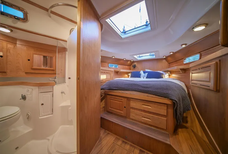 Slide: The Image of Manufacturer Provided Image: Luxurious interior of 2026 Tartan 455 yacht featuring cozy bedroom and modern bathroom. - 11