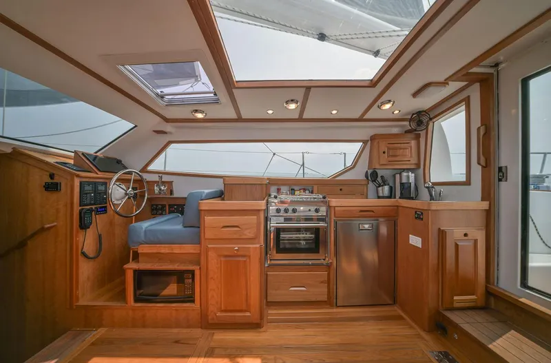 Slide: The Image of Manufacturer Provided Image: Interior of 2026 Tartan 455 yacht with wooden cabinetry and modern appliances. - 5