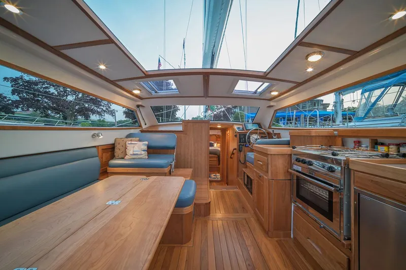 Slide: The Image of Manufacturer Provided Image: Luxurious interior of 2026 Tartan 455 sailboat with wood finish and modern amenities. - 6