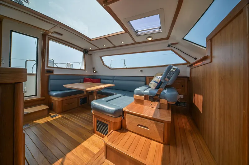 Slide: The Image of Manufacturer Provided Image: Luxurious interior of 2026 Tartan 455 yacht with wooden flooring and blue seating. - 8