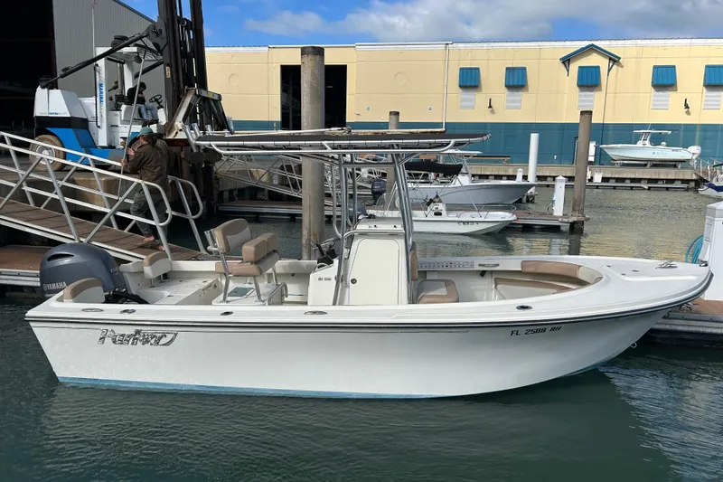 The Image of 2017 Parker 21SE Center Console boat docked at marina with Yamaha engine. - 1