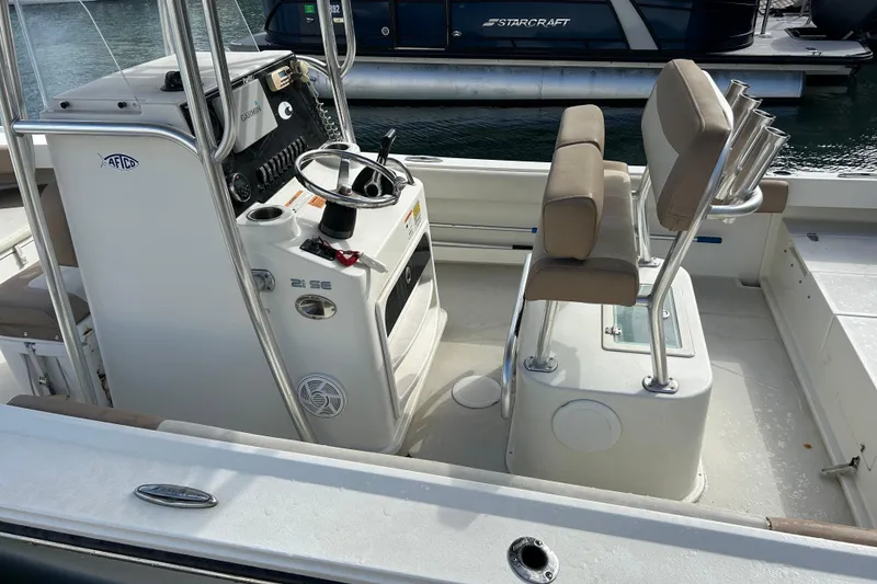 Slide: The Image of 2017 Parker 21SE Center Console boat interior with steering wheel and seating. - 4