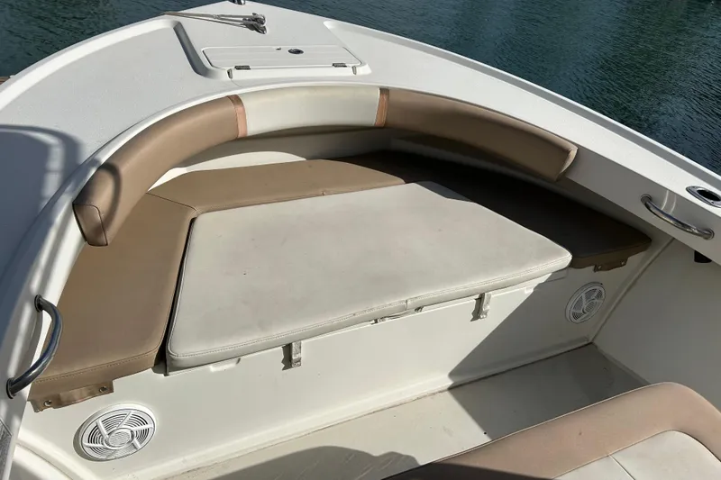 Slide: The Image of 2017 Parker 21SE Center Console boat interior with cushioned seating and storage. - 7